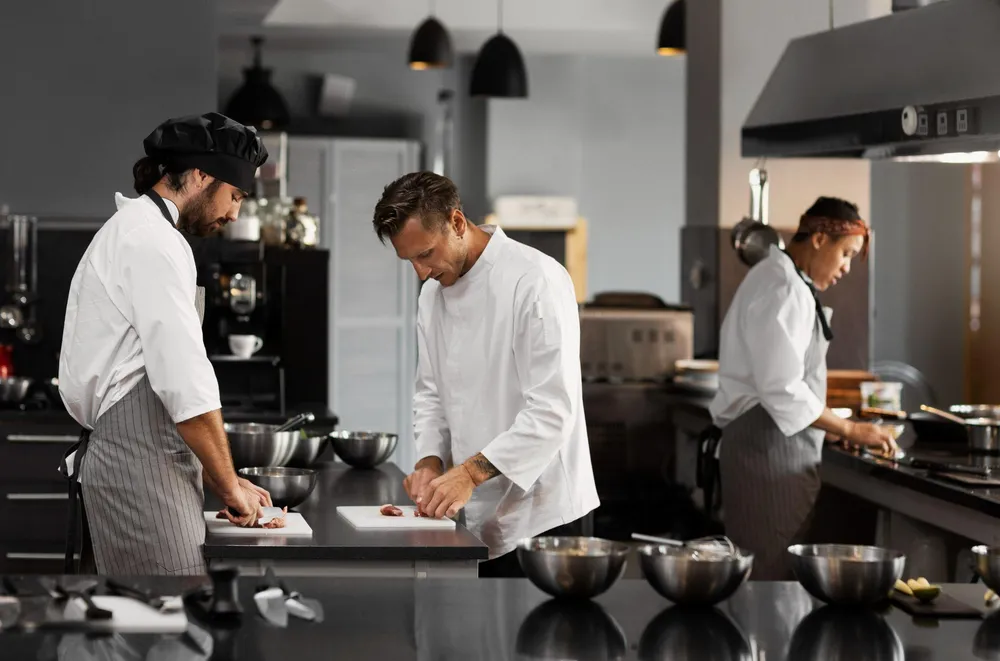 Kitchen team working through service in an established commercial kitchen.